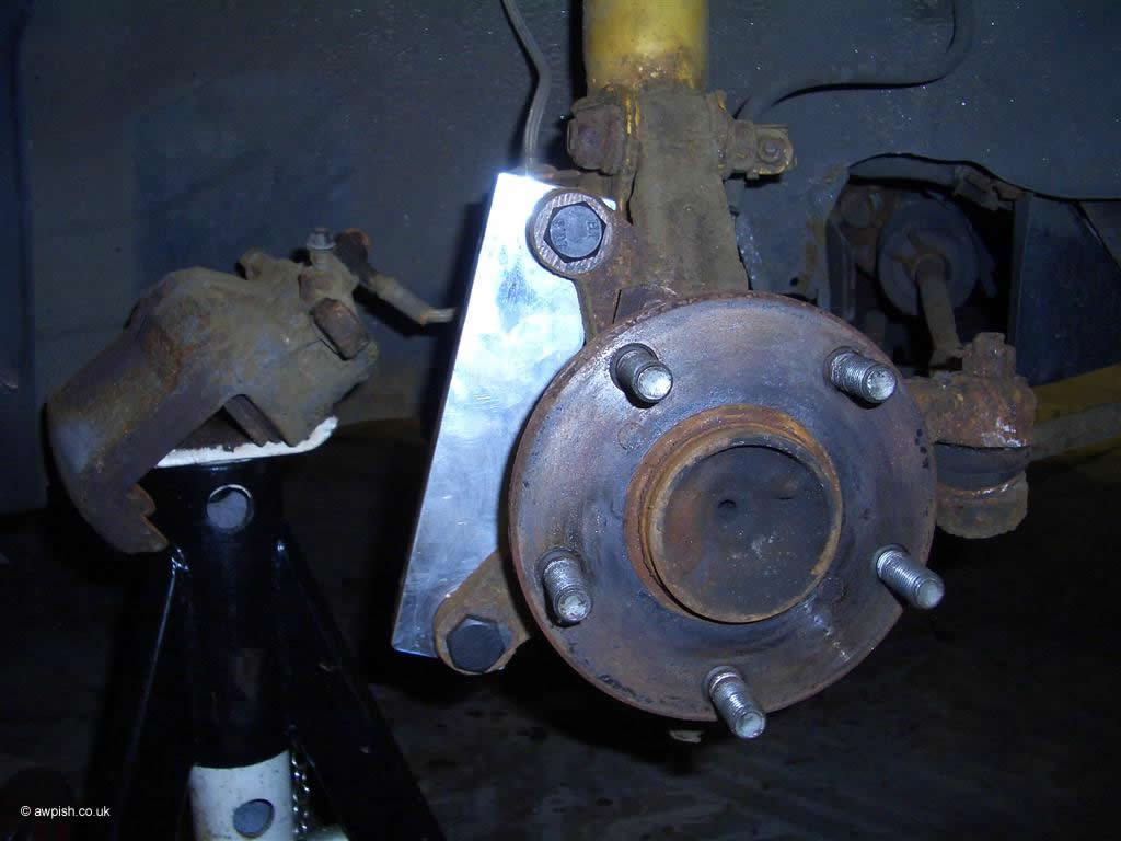 fitting of front caliper adaptor brackets