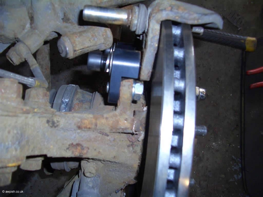 rear carrier bracket in place with disc and carrier in position